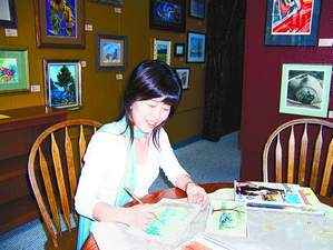 Reiko Hervin demonstrates the watercolor pencil technique she will be teaching at a workshop June 3 in Gardnerville.